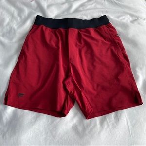Fabletics 7in inseam red lined shorts size M
